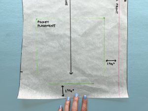 Green markings indicate pocket placement on a sewing pattern.