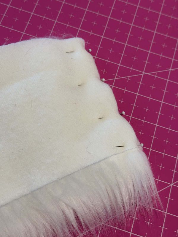 Couched Christmas Stocking- Pinning a seam in faux fur trim