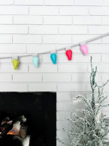 Felt Bulb Garland Tutorial - Garland on brick wall