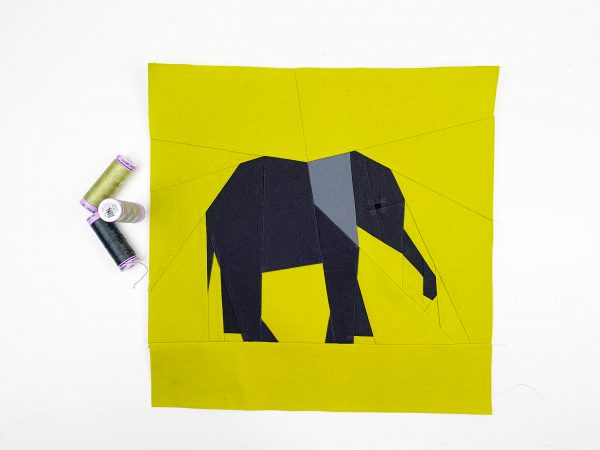 baby elephant quilt block pattern in gray on light green background