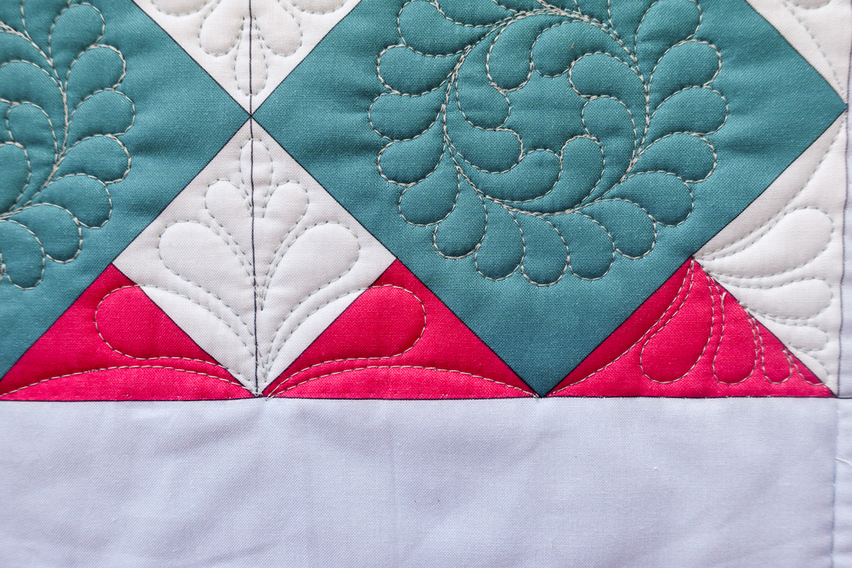 Close-up view of quilting on the Jump for Joy Quilt Diamond Block section