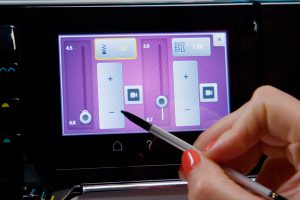 the display screen shows the adjustment functions for stitch length
