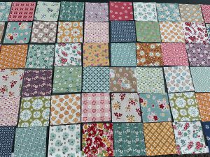 3.5" squares of quilting fabric laid out