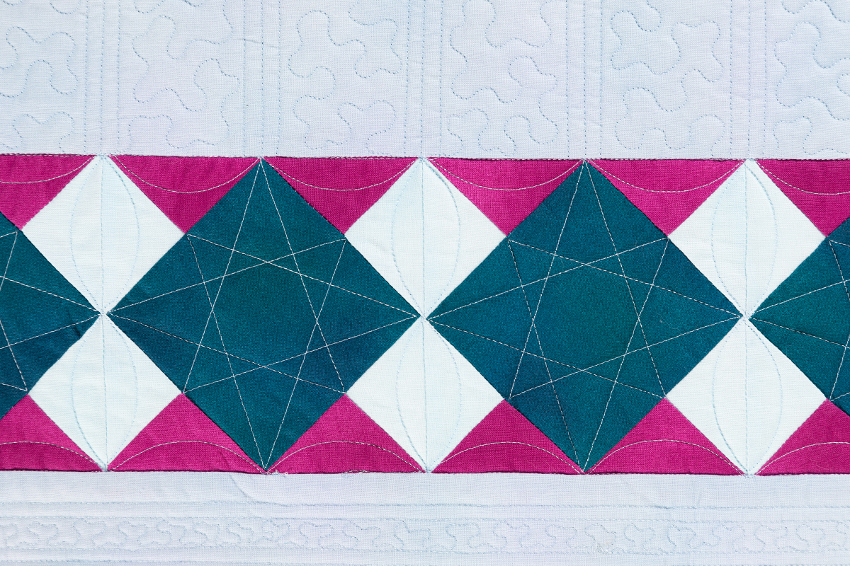 blue and pink diamonds on the Jump for Joy quilt.