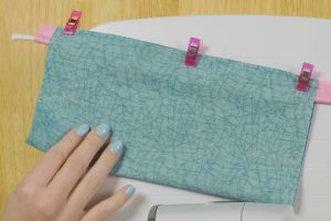 overhead view of piping inserted between fabric seams