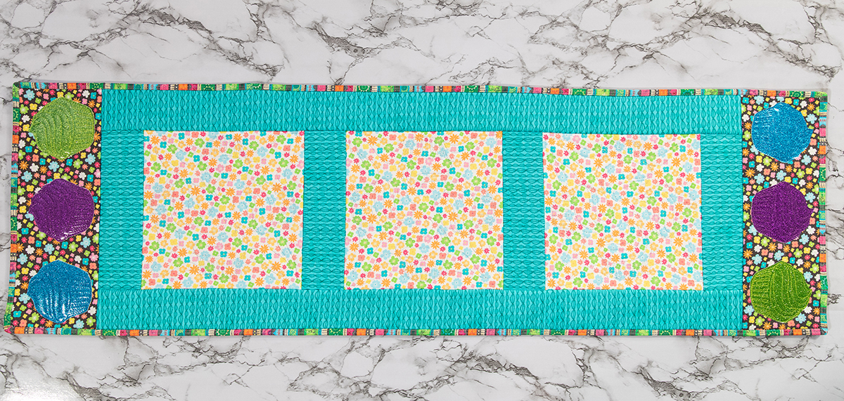 overhead shot of the finished multi-color table runner.