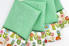 overhead photo of flowered and green fabric upcycled napkins