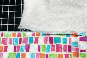 pulling black chainstitch off of multi-color fabric