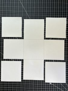 Cut-out vinyl/interfacing square on black cutting mat