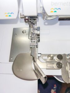 Front view of the clear foot and binder attachment on the machine.