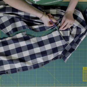 Scissors used to cut shoulders around back of collar