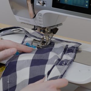 Machine being used to sew down the hem