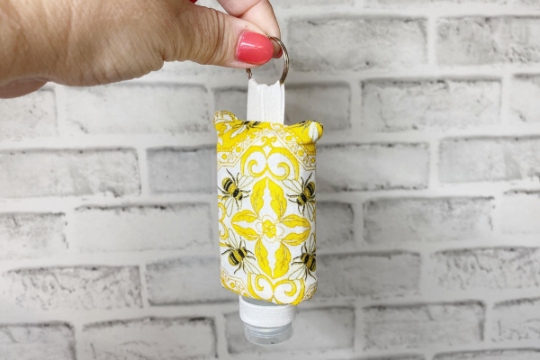 Yellow hand sanitizer case with bee design