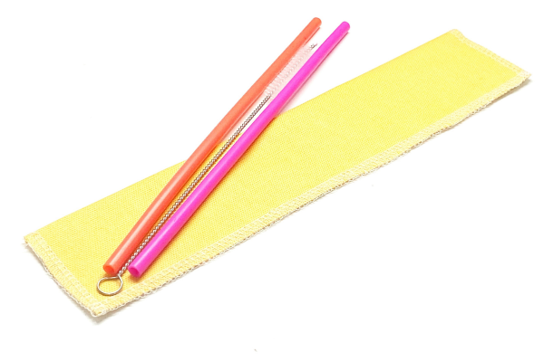 Pink and orange straws on yellow case