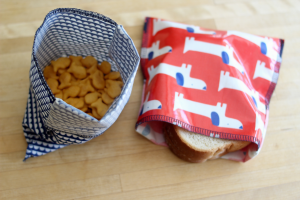 Reusable snack pouches with crackers and sandwich