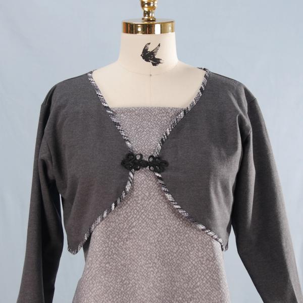 Gray bolero on manikin on light gray background