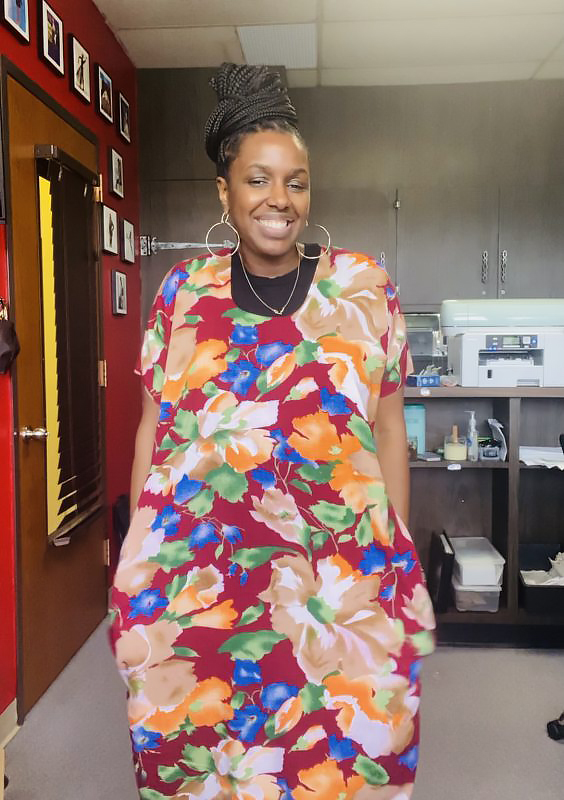 Woman wearing multi-colored upcycled dress