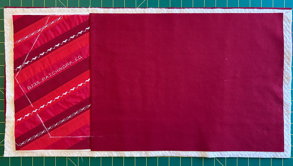 red embroidered quilt sandwich