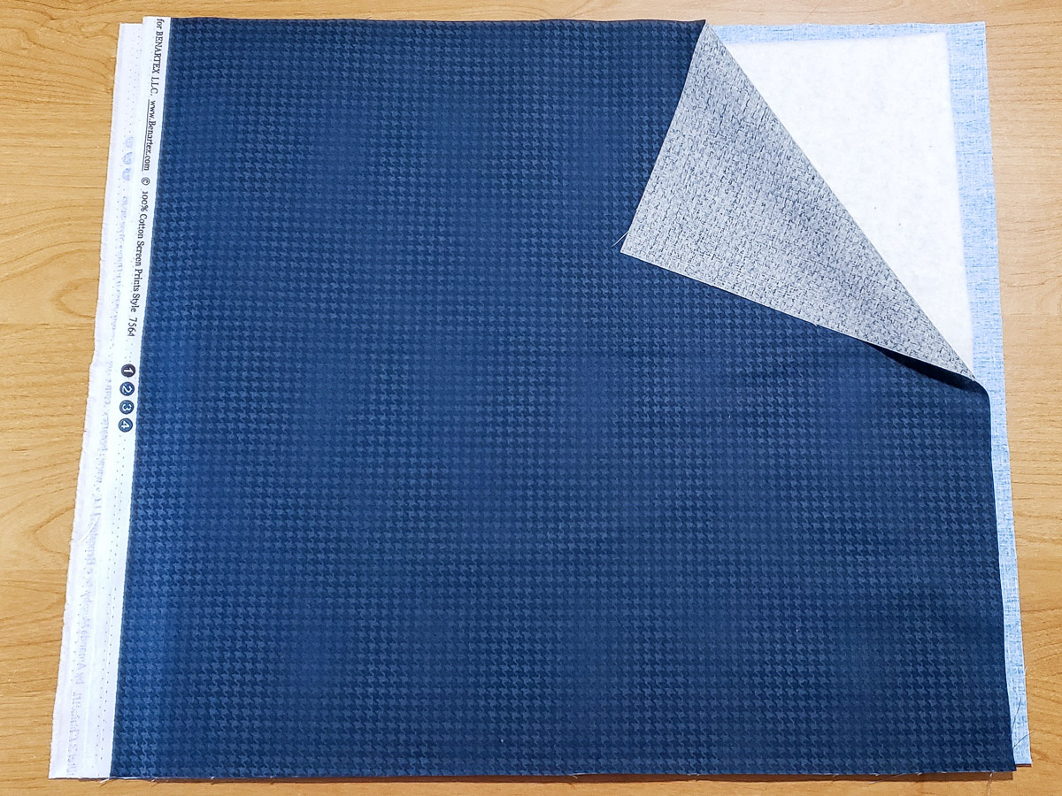 fabric and batting sandwich, with dark blue fat quarter