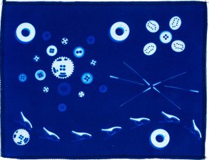 Sewing notions final result showcasing white imprints on a brilliant blue fabric