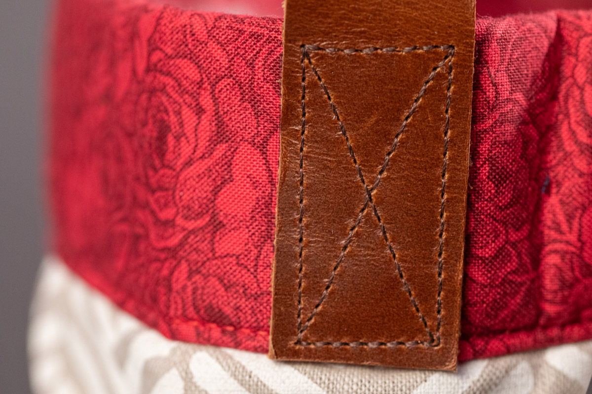 close up of leather stitching on a tote bag