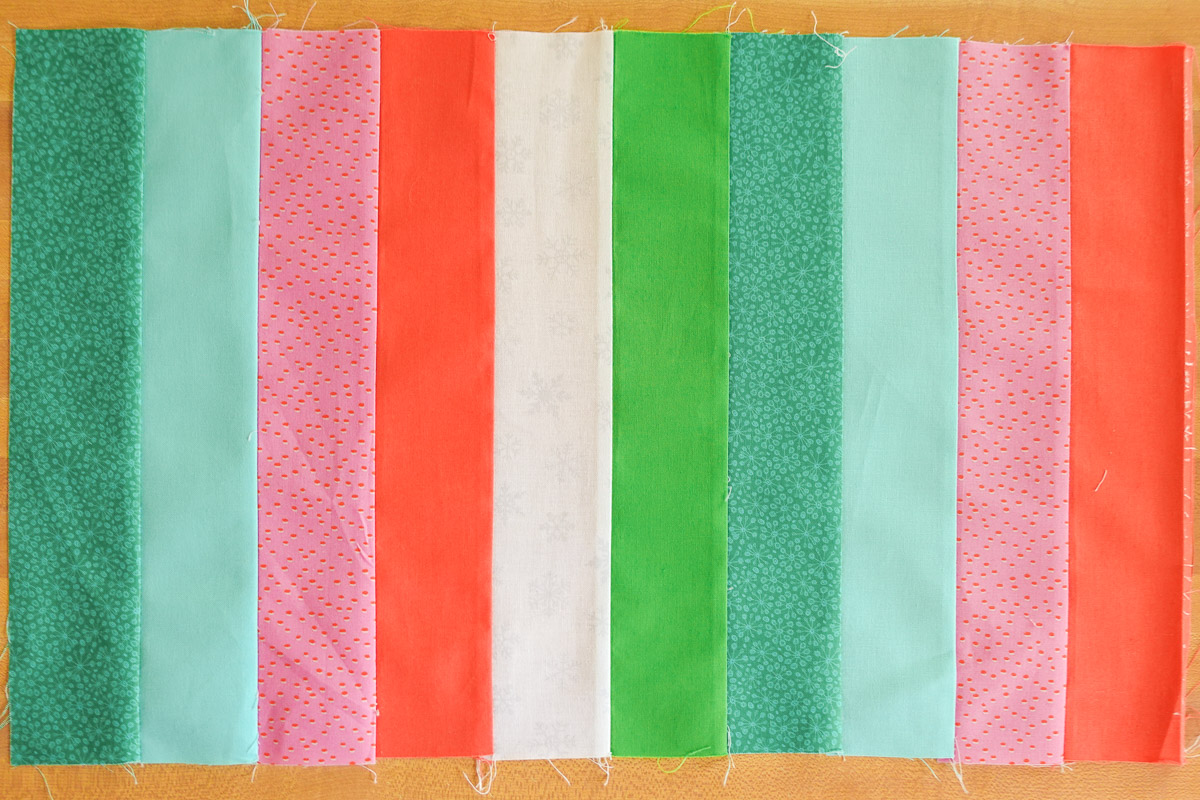 Blue, red, pink, and green striped fabric piece