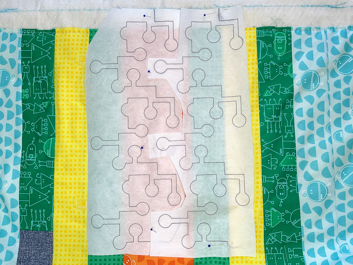 Test designer on stabilizer over the quilt