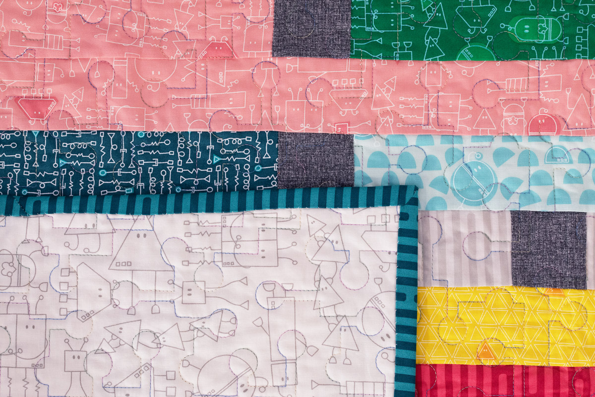 Overhead view of binding on the jelly roll quilt