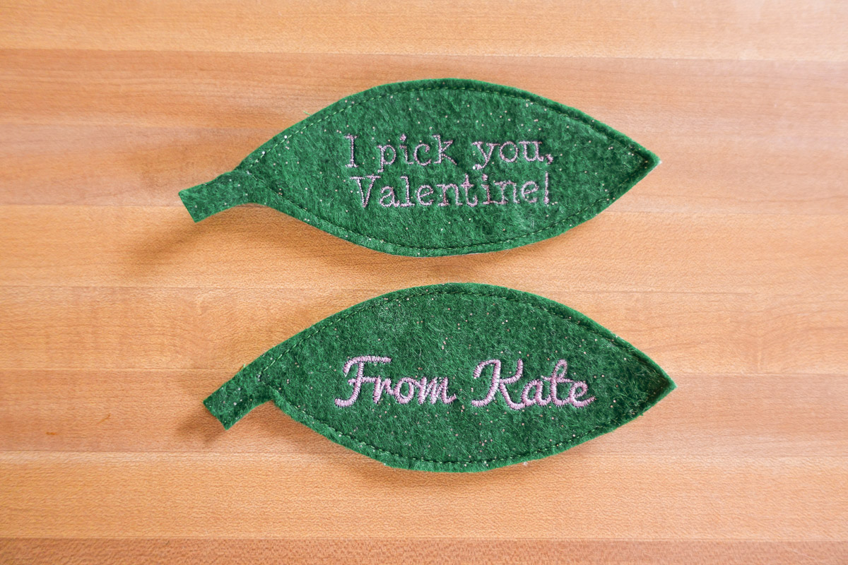 Finished embroidered text on green leaves