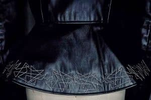 Back peplum with embroidery at Center Back