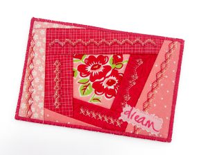 Fabric postcard with decorative stitching
