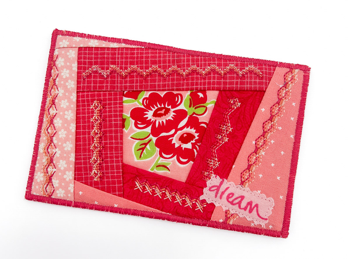 Fabric postcard with decorative stitching