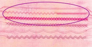 Stitches on fabric with triple needle