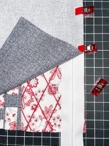 Overhead view of a zipper being clipped to fabric
