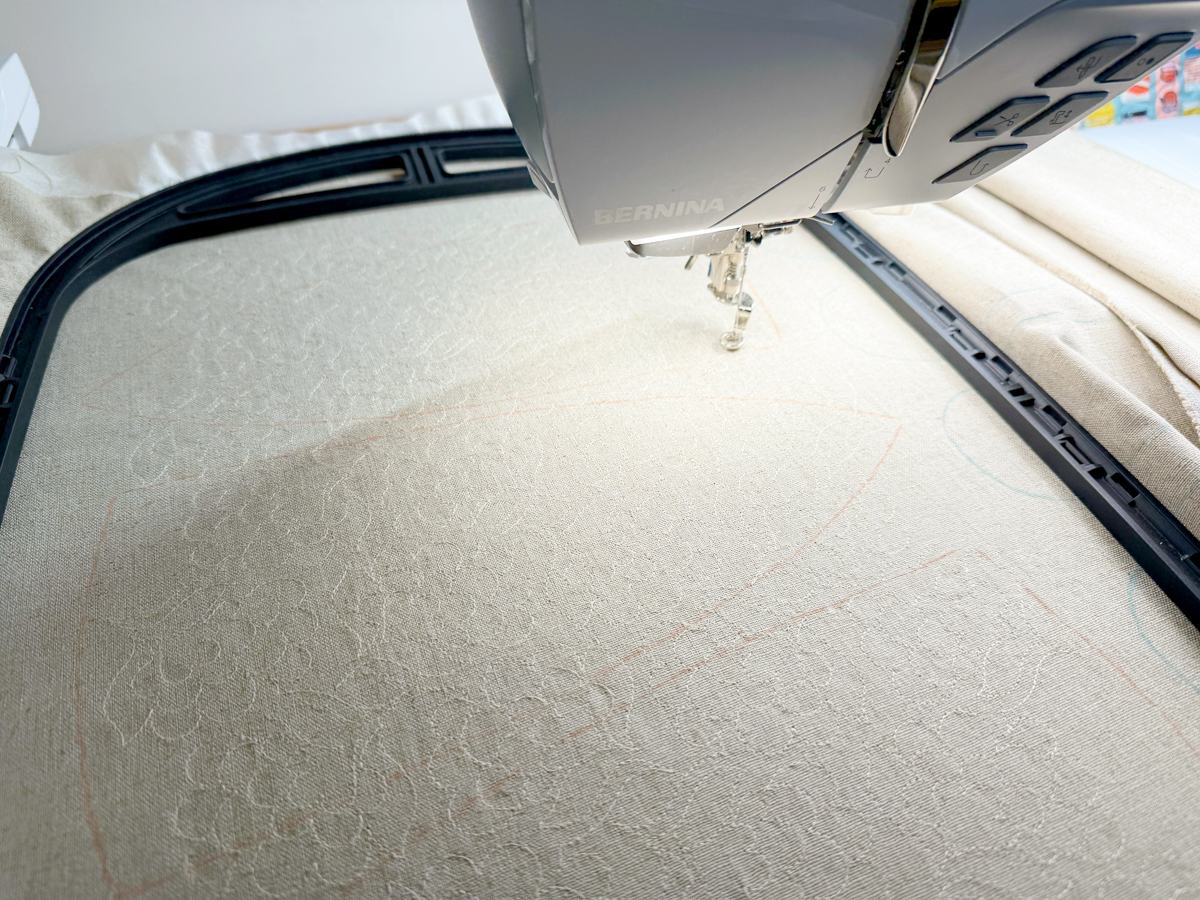 Quilt design stitching in progress for the embroidered Flora Lapin fabric on the Giant Hoop with the B 990