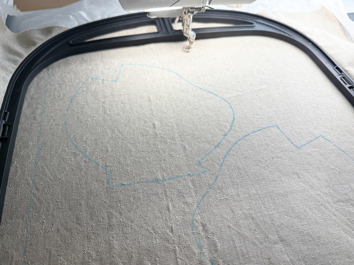 Quilt design stitching in progress for the embroidered Flora Lapin fabric on the Giant Hoop with the B 990