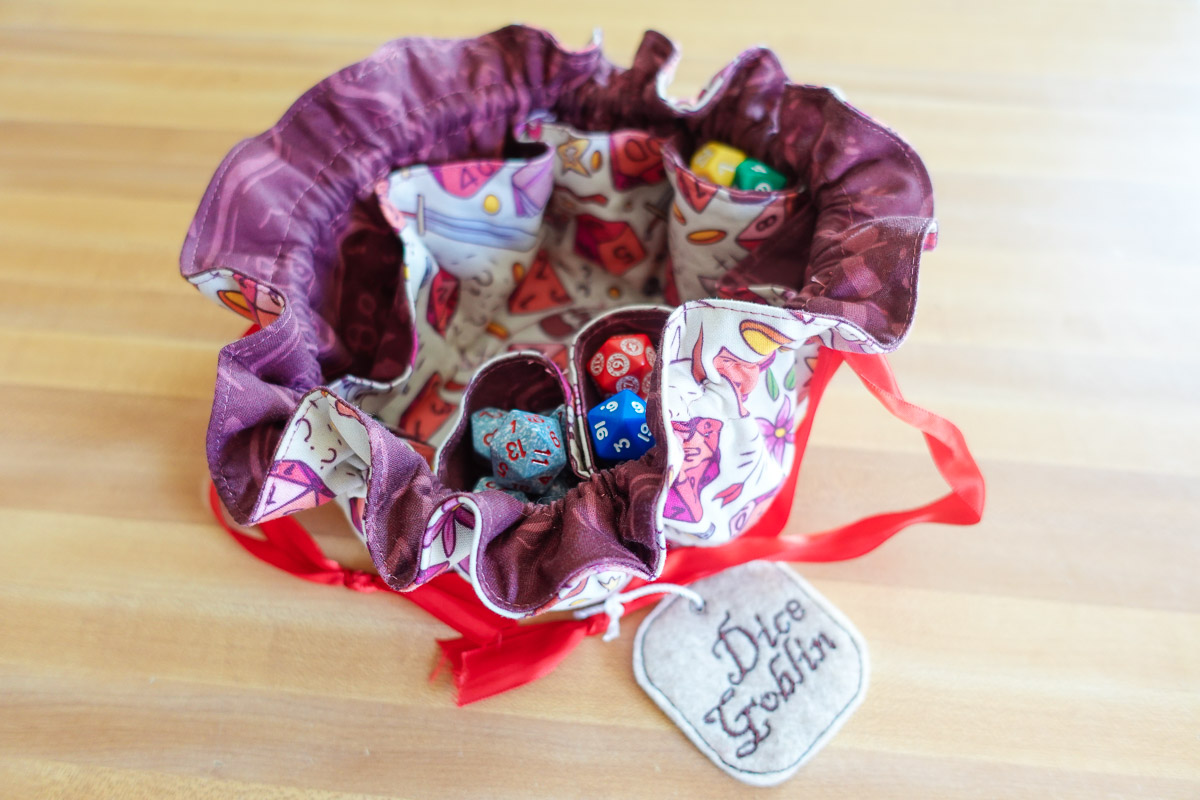A handsewn DND dice  bag with dice inside