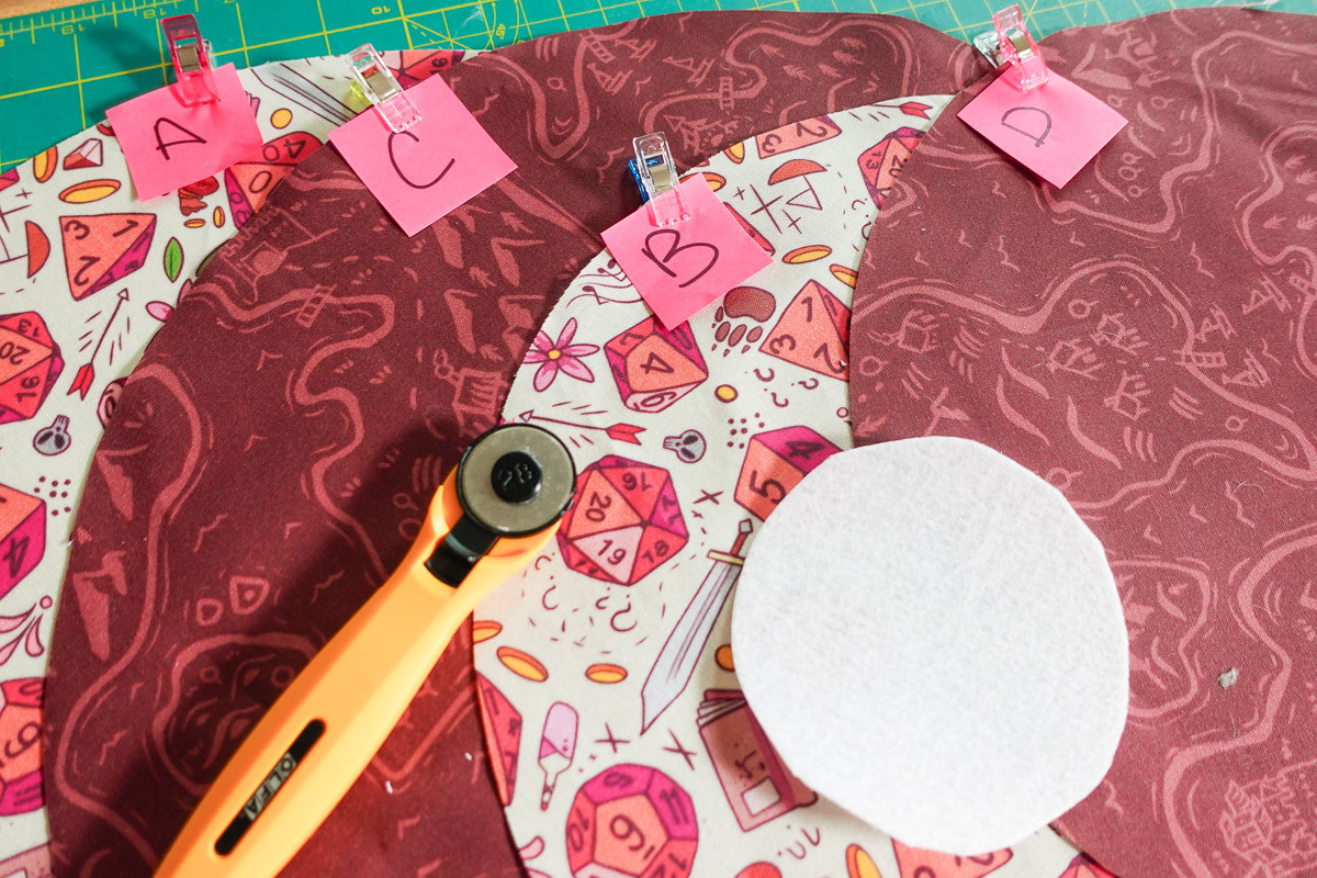 Array of fabric cut into circles and labeled A, B, C, and D