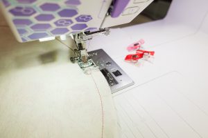 Close up of the b79 sewing around the edge of a circle of fabric