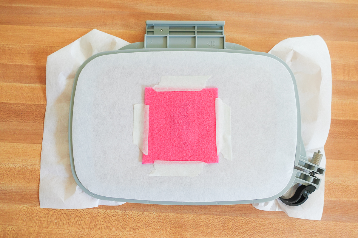 overhead view of pink felt taped in place