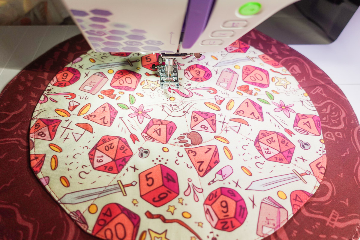 sewing colorful fabric for a DND Dice bag with the b79