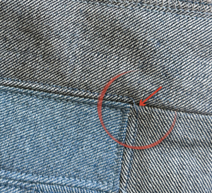 close up of a denim quilt block sewn with a coverstitch