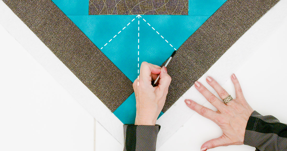 Overhead view of the diagram used to set up for Rulerwork quilting on a piece of teal fabric.