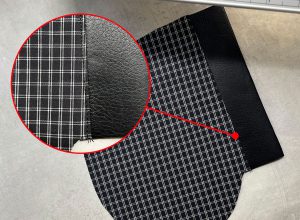 A close up image detailing the understitching of the seam allowance of the welt to the front pocket bag facing