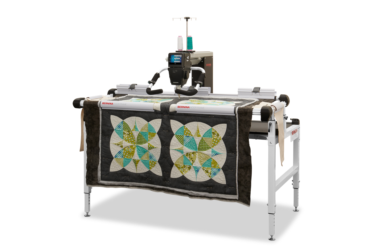 BERNINA Hoop Frame paired with a longarm and black and colorful quilt