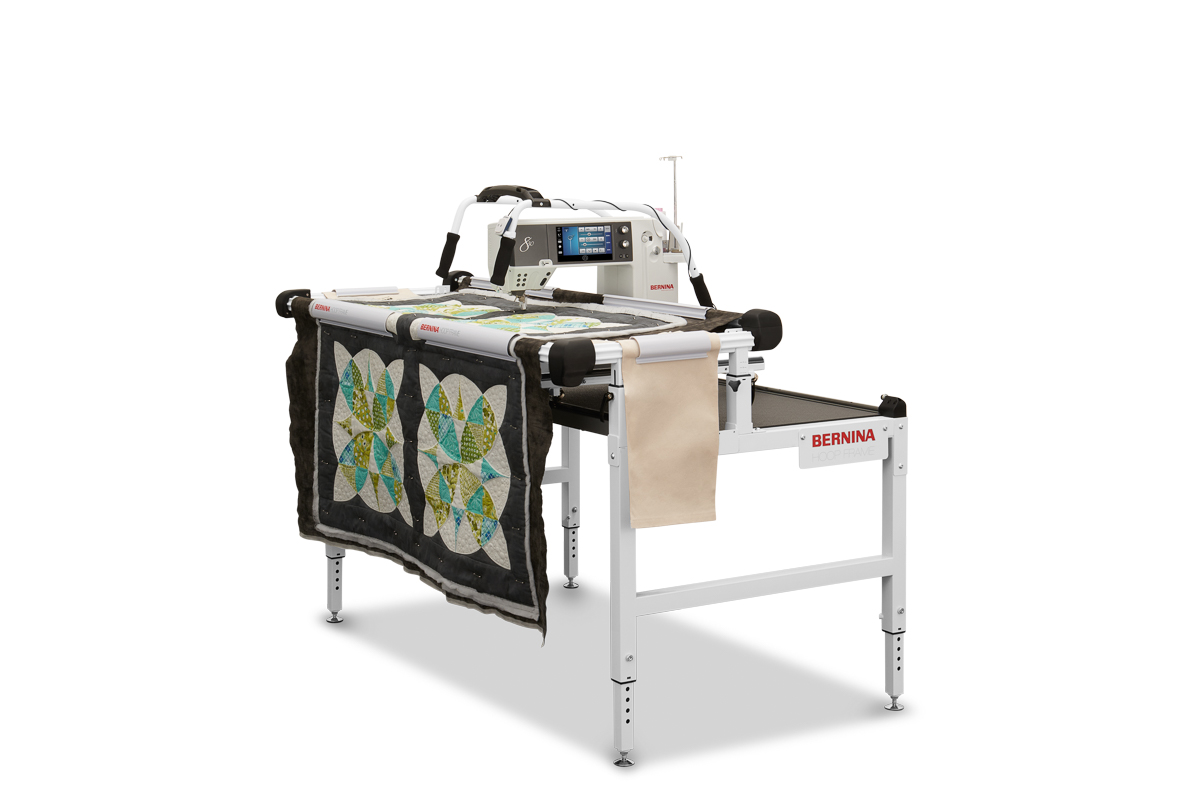 BERNINA Hoop Frame paired with a longarm and black and colorful quilt