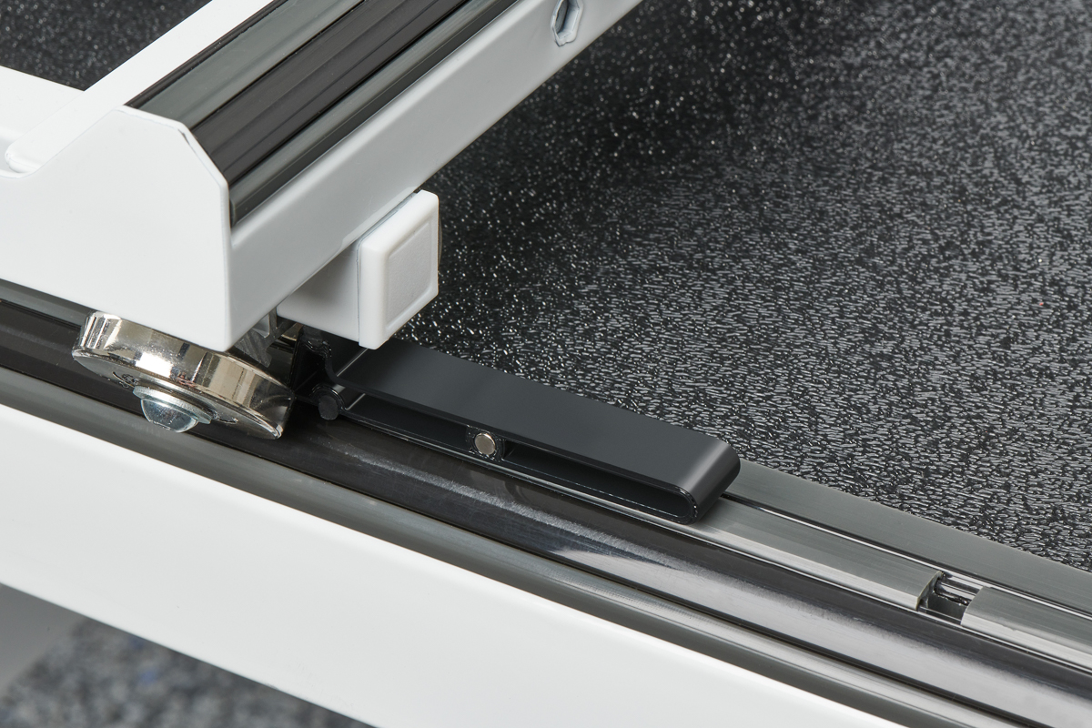 Close up view of the black leverlock on the BERNINA Hoop Frame