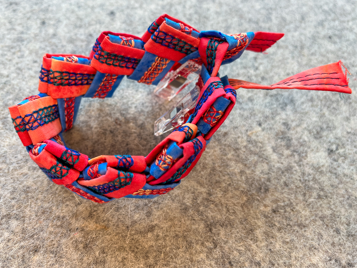 Pulling the other side of the fabric through