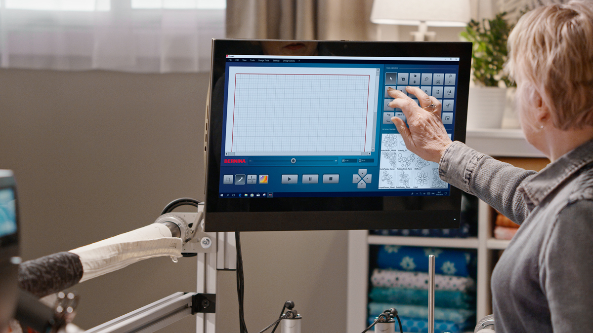 Person using Q-matic Touch screen