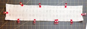 main fabric on wrong side with red clips